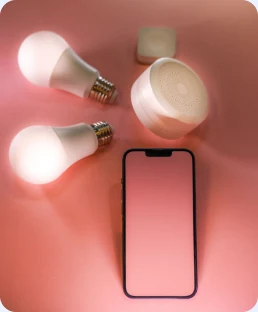 Light bulbs arranged beside a phone