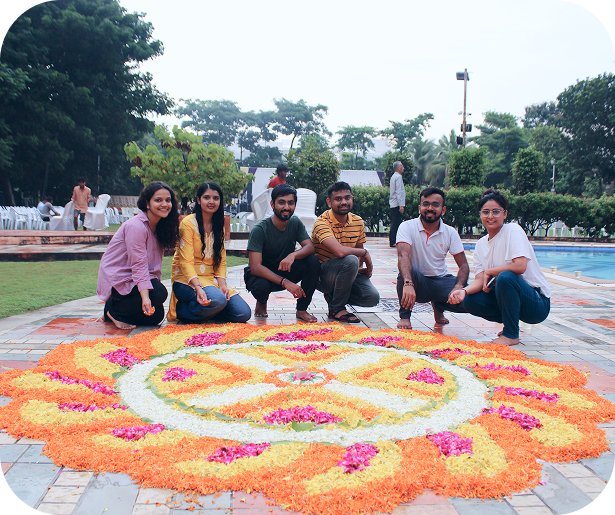 Team outdoor event with colorful rangoli